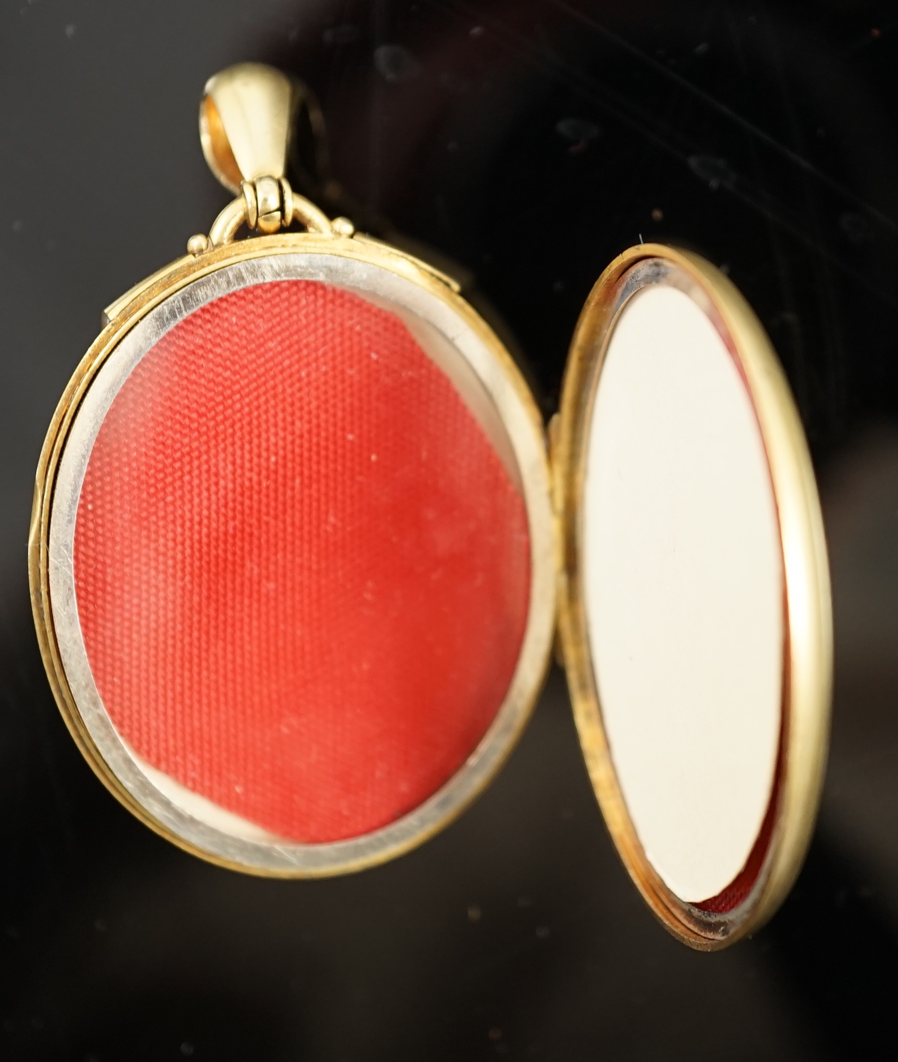 A Victorian gold, diamond and split pearl set oval locket